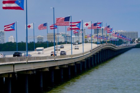 Cars on a freeway over the water in Puerto Ricco